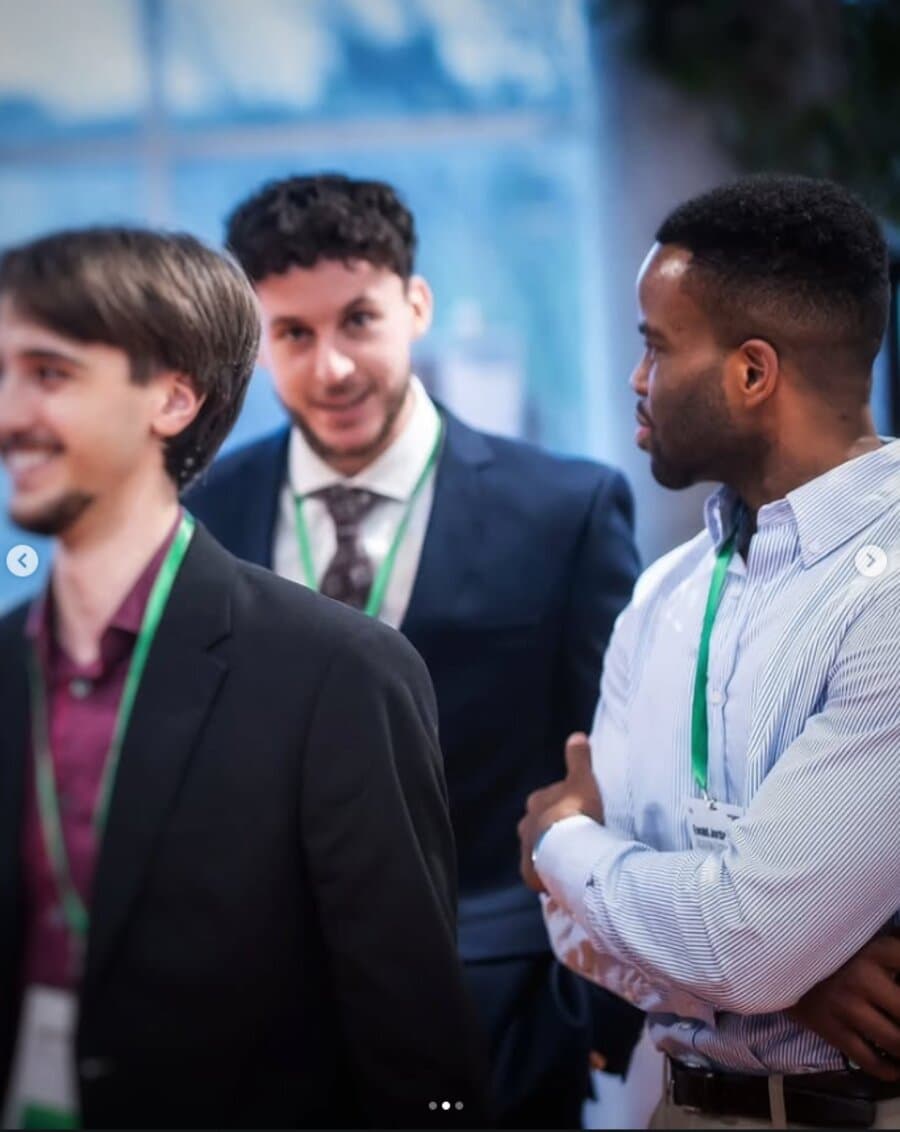Ewald Ngandjui networking at a tech event